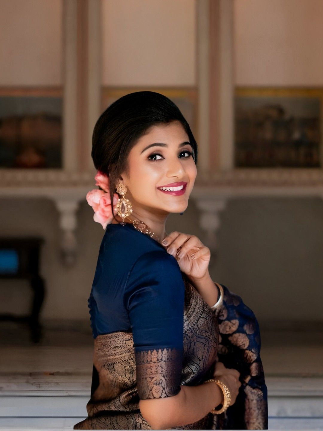 Model in Neelvanta Eclipse standing tall in palace hall