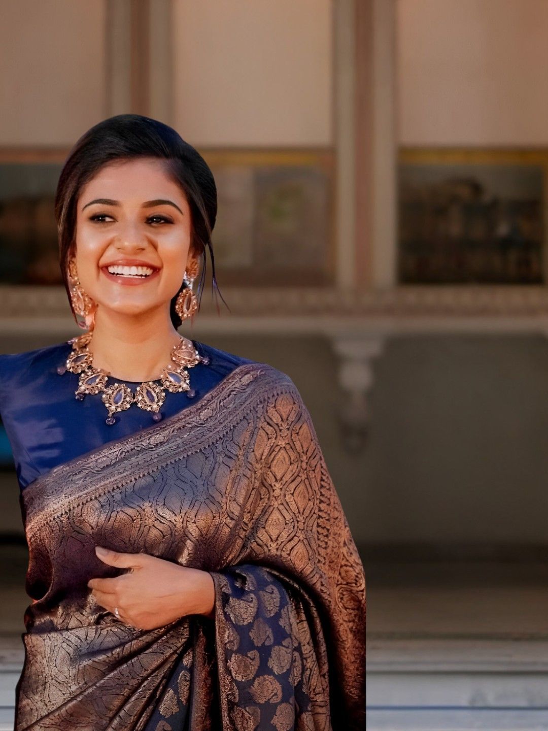 Side pose highlighting shoulder drape and print glow