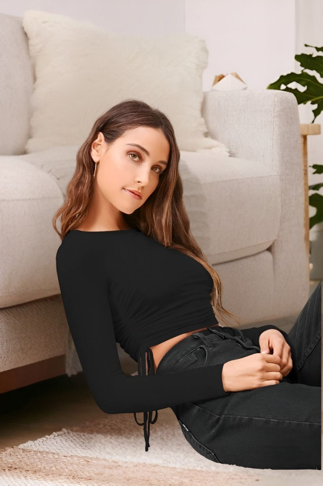 Left side angle of black polyester women’s top