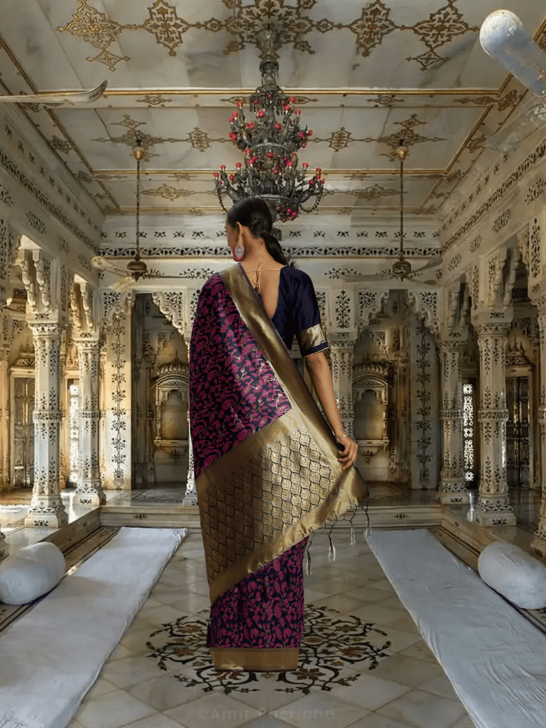 Golden diamond pallu of navy pink saree showcased in royal interior