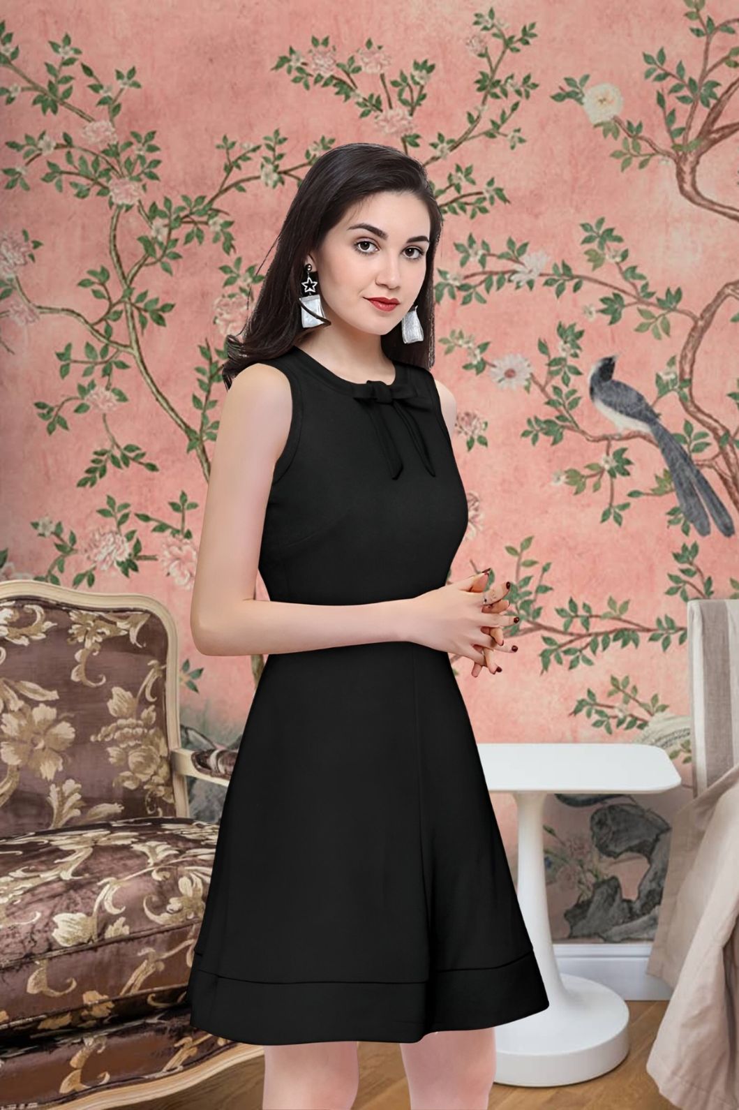 Side angle of Celestina’s sleeveless black polyester dress with round neck