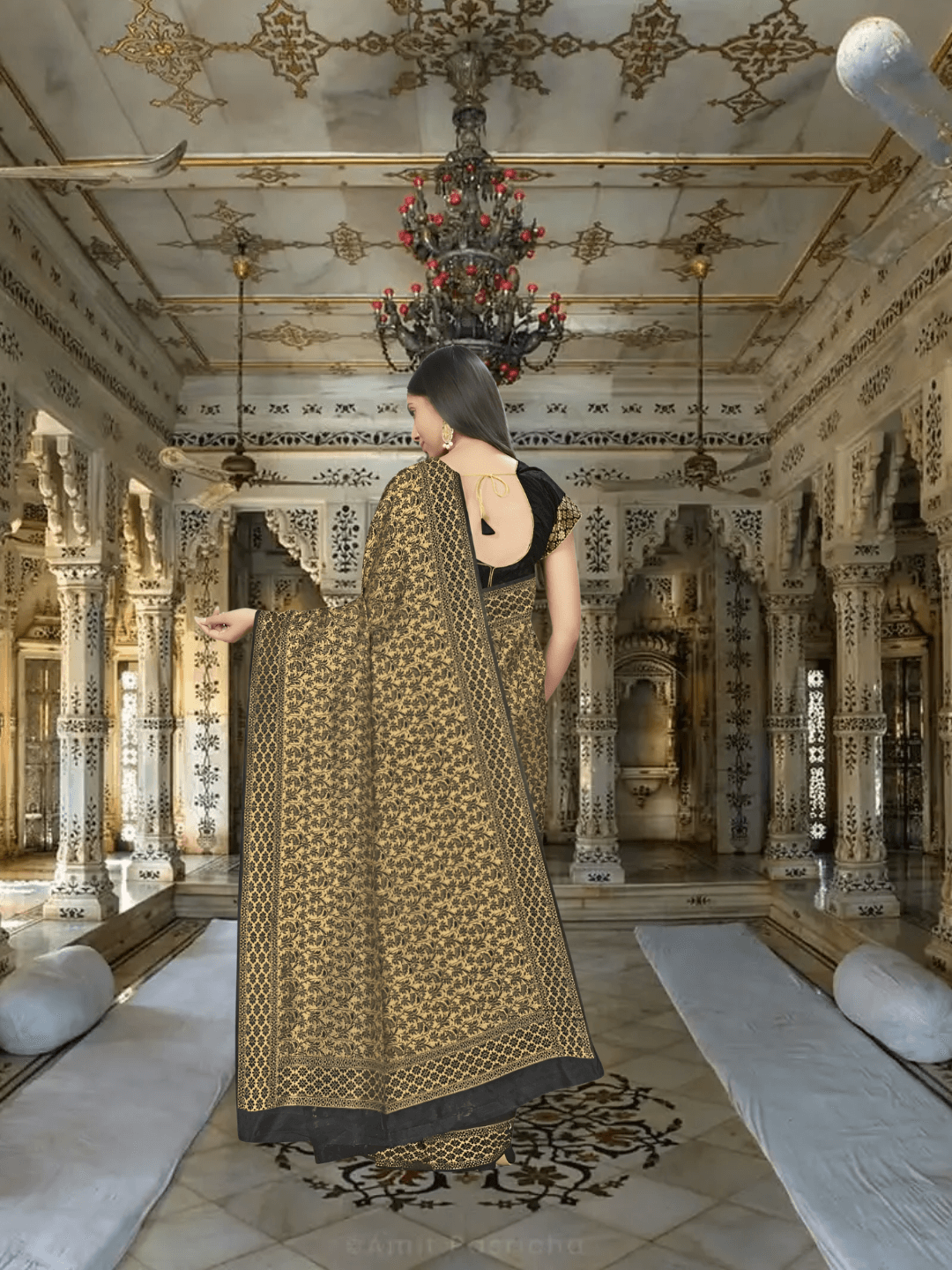 Banarasi silk pallu flowing with golden motifs in luxurious setting