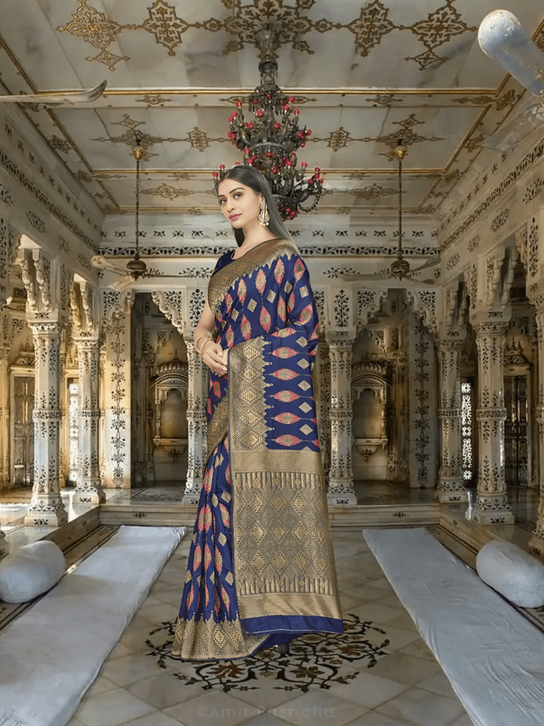 Navy Banarasi against crashing waves, gold borders mimicking lightning on water