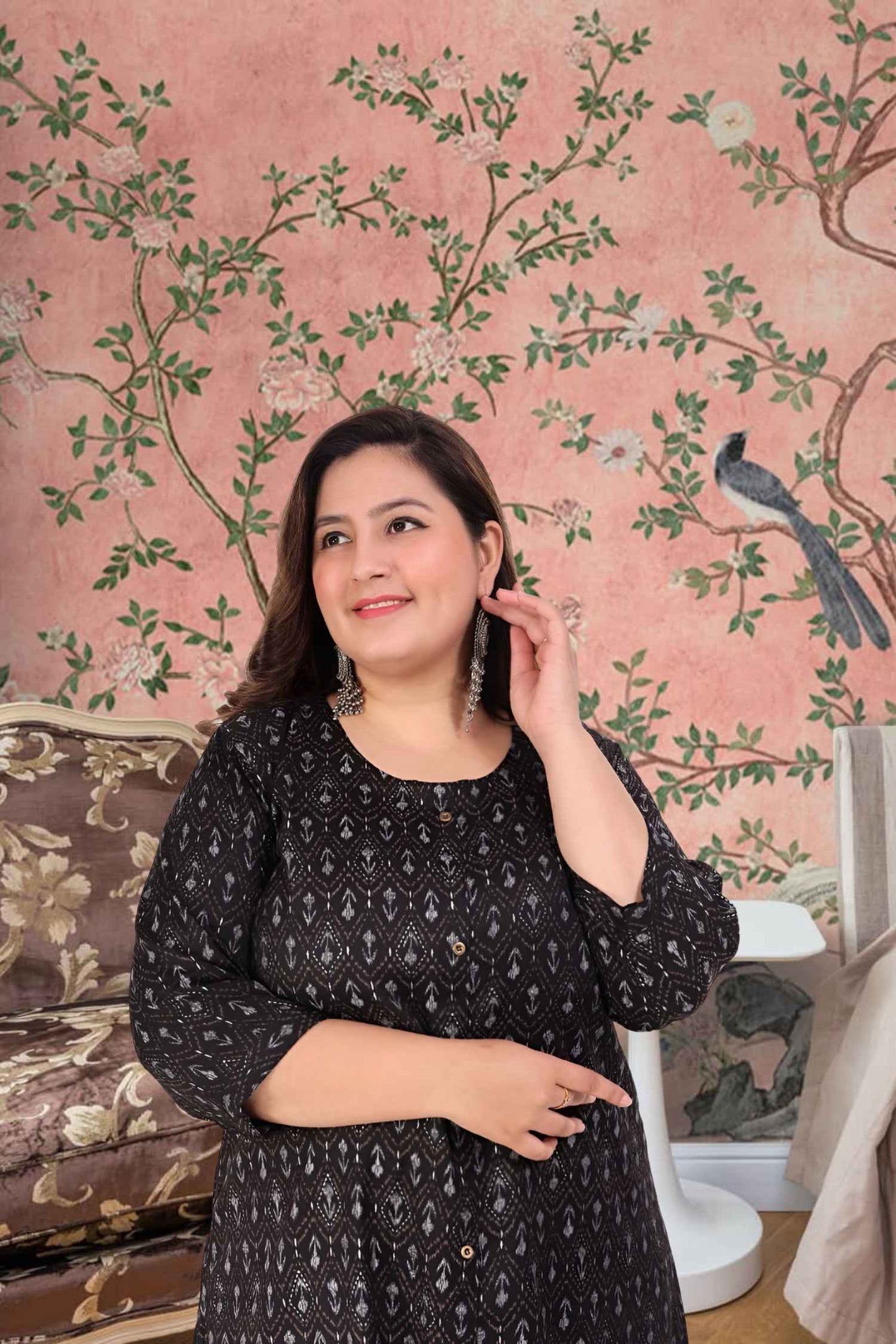 Front view: Black kurti against a soft golden-hour skyline