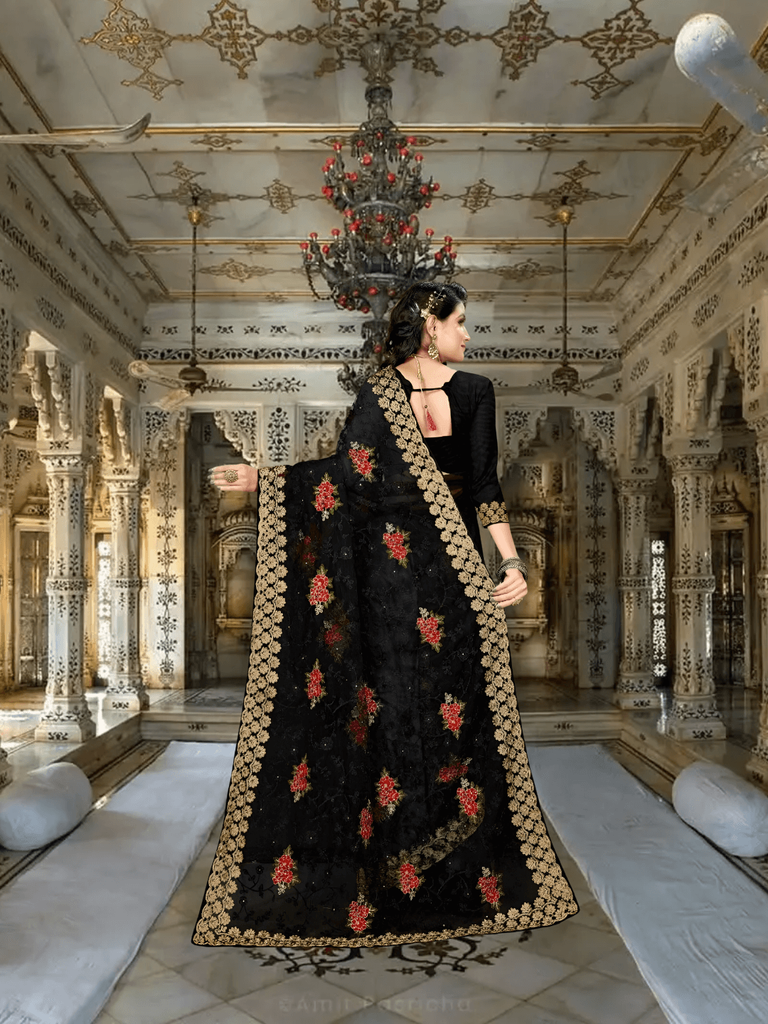 Model mid-step, saree flowing like spilled ink, silver stitches catching candlelight