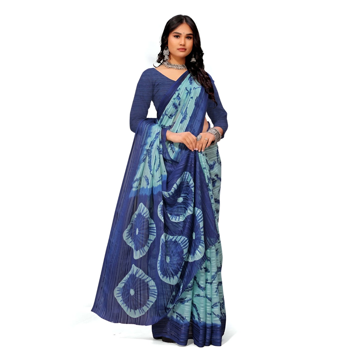 Dark blue-green georgette saree flat lay – ocean-to-jungle elegance