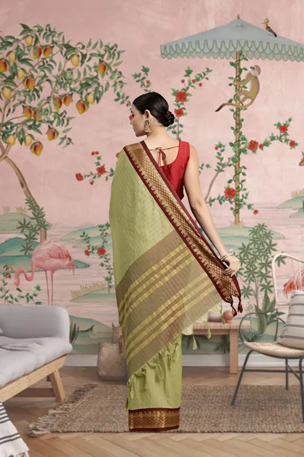 Rear view showing pallu fall in earthy olive tones