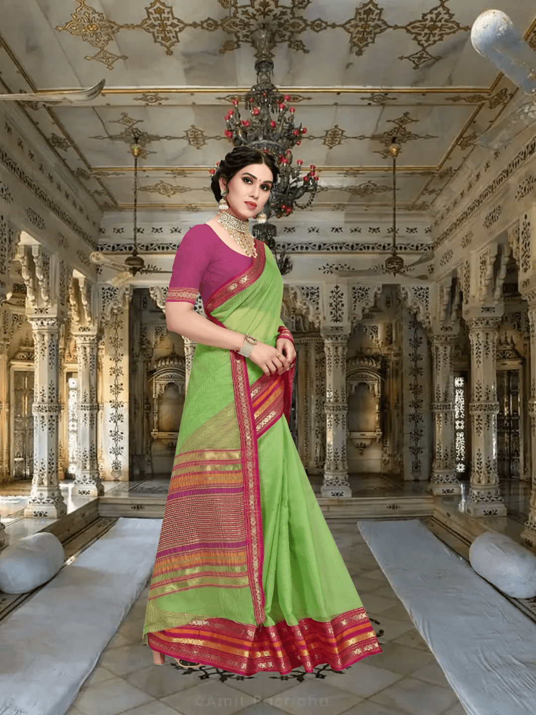 Model in parrot green saree walking through royal arches, border catching morning light