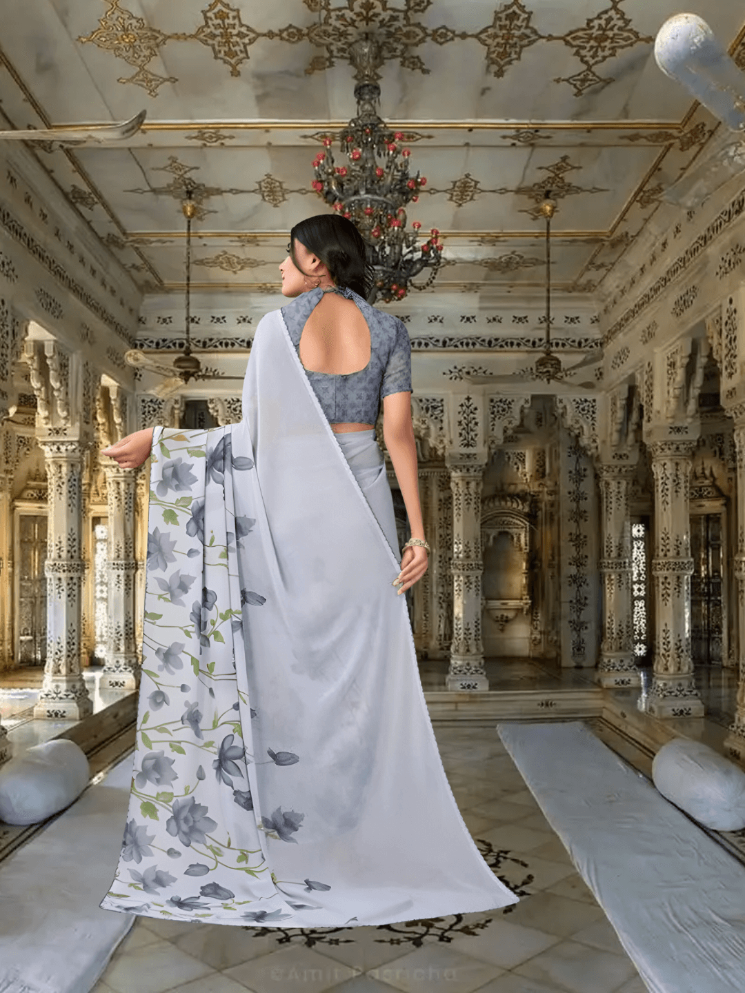 Model twirling to show floral pallu movement