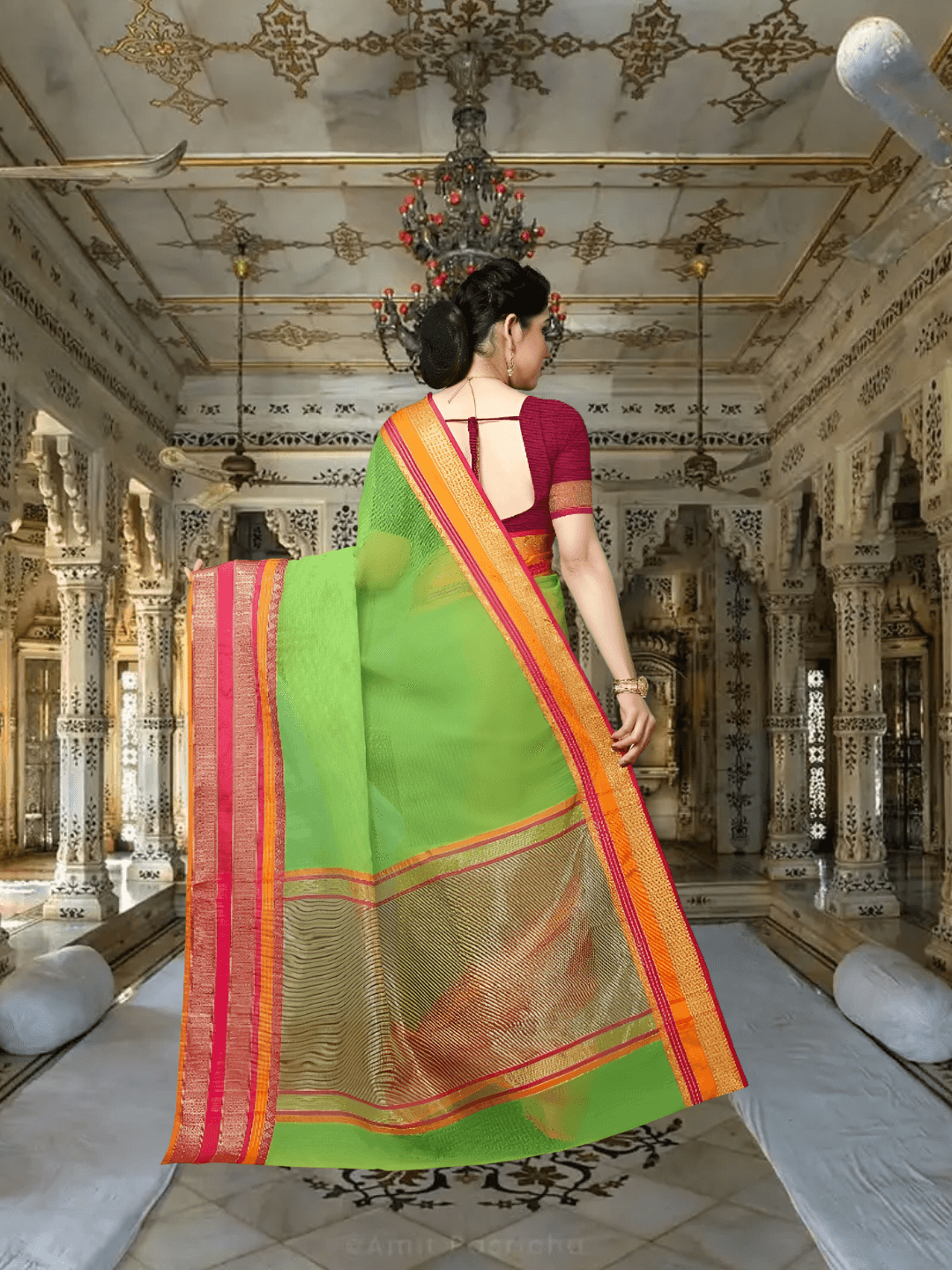 Long shot of saree in motion with pink-golden border trailing behind her steps