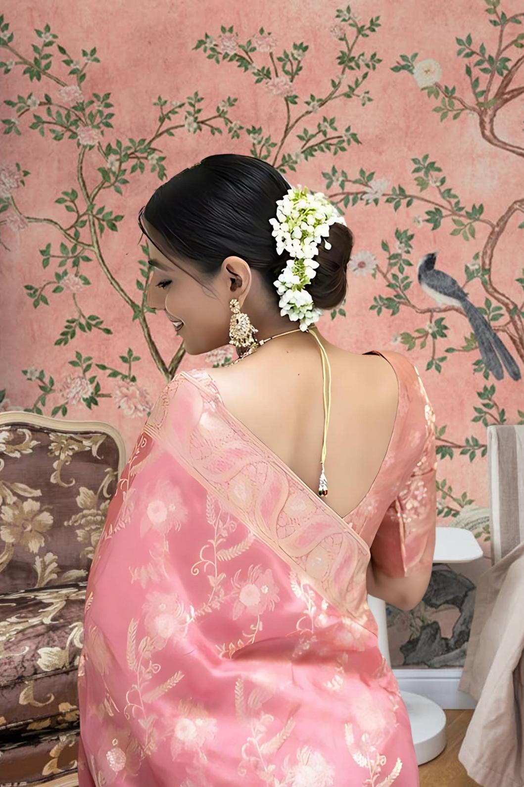 Back view with embellished pallu cascading like dawn light