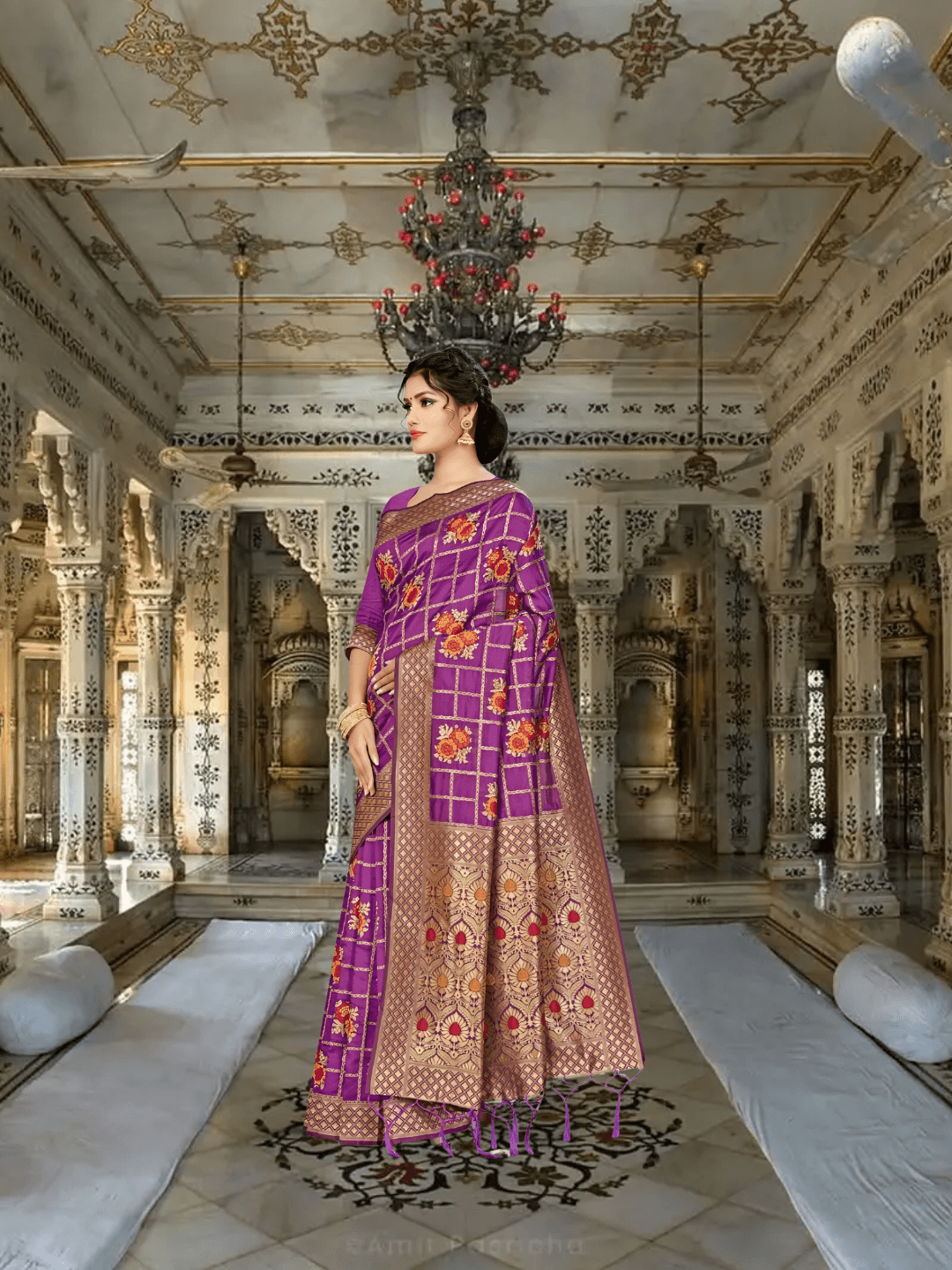 Close-up of blooming red-orange floral motifs inside golden grid on purple silk