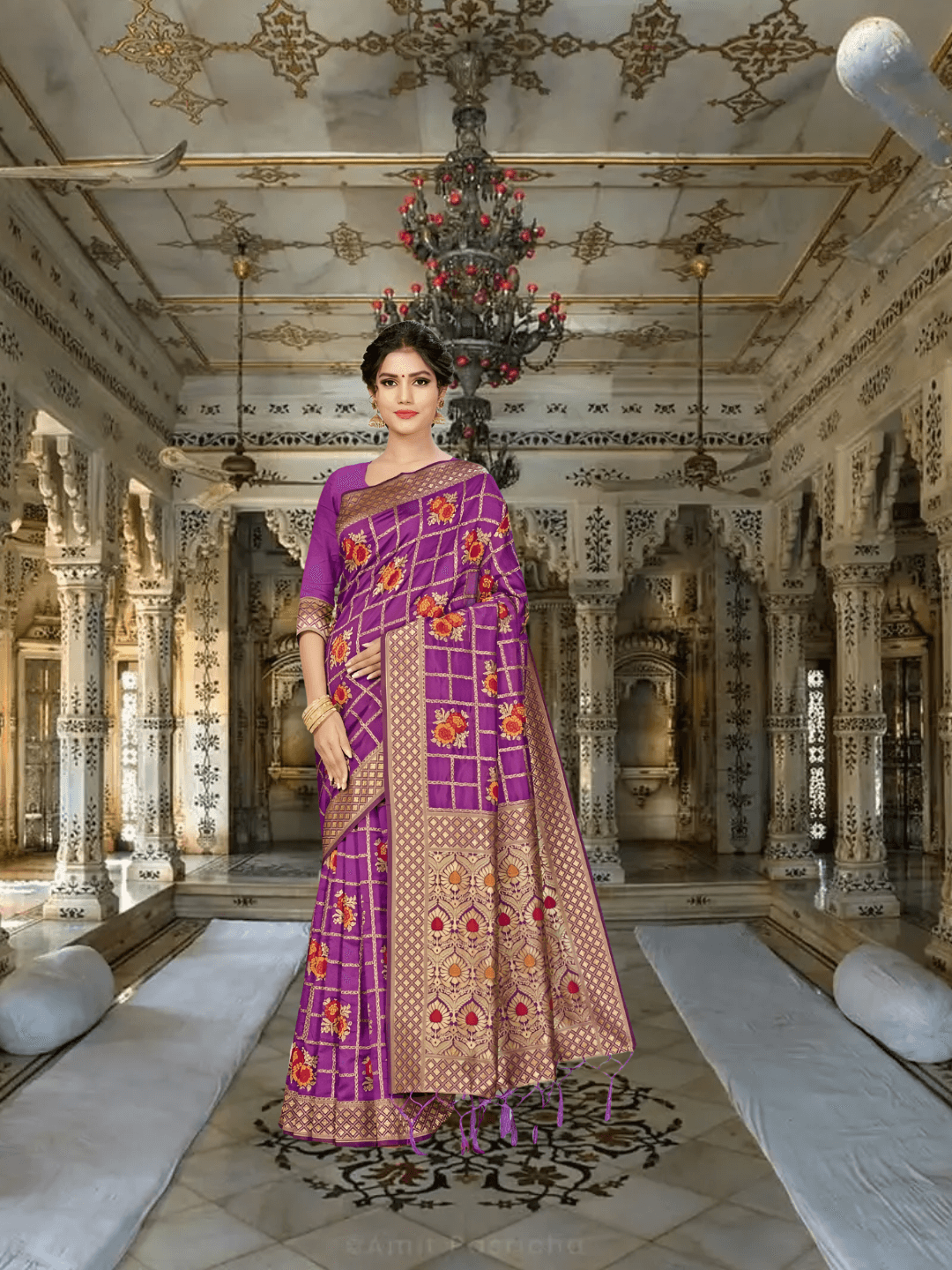 Model wearing purple Banarasi silk saree with gold and floral patterns in palace room