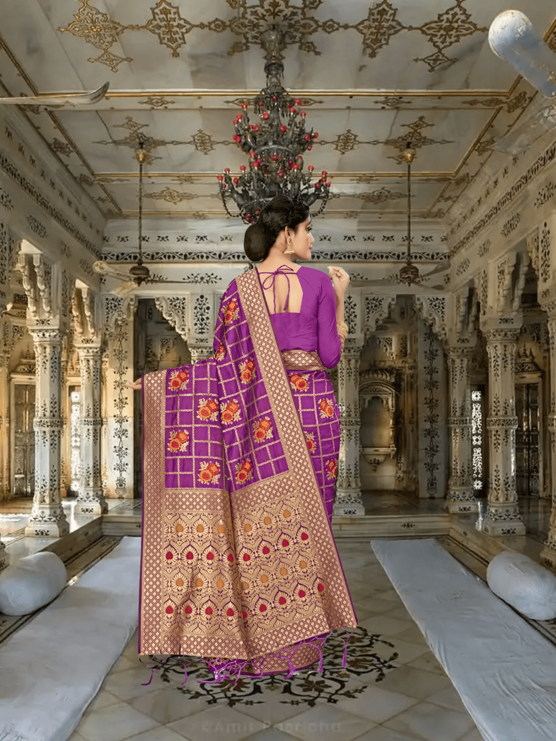 Detailed view of pallu with golden motifs and floral grid design in royal setting