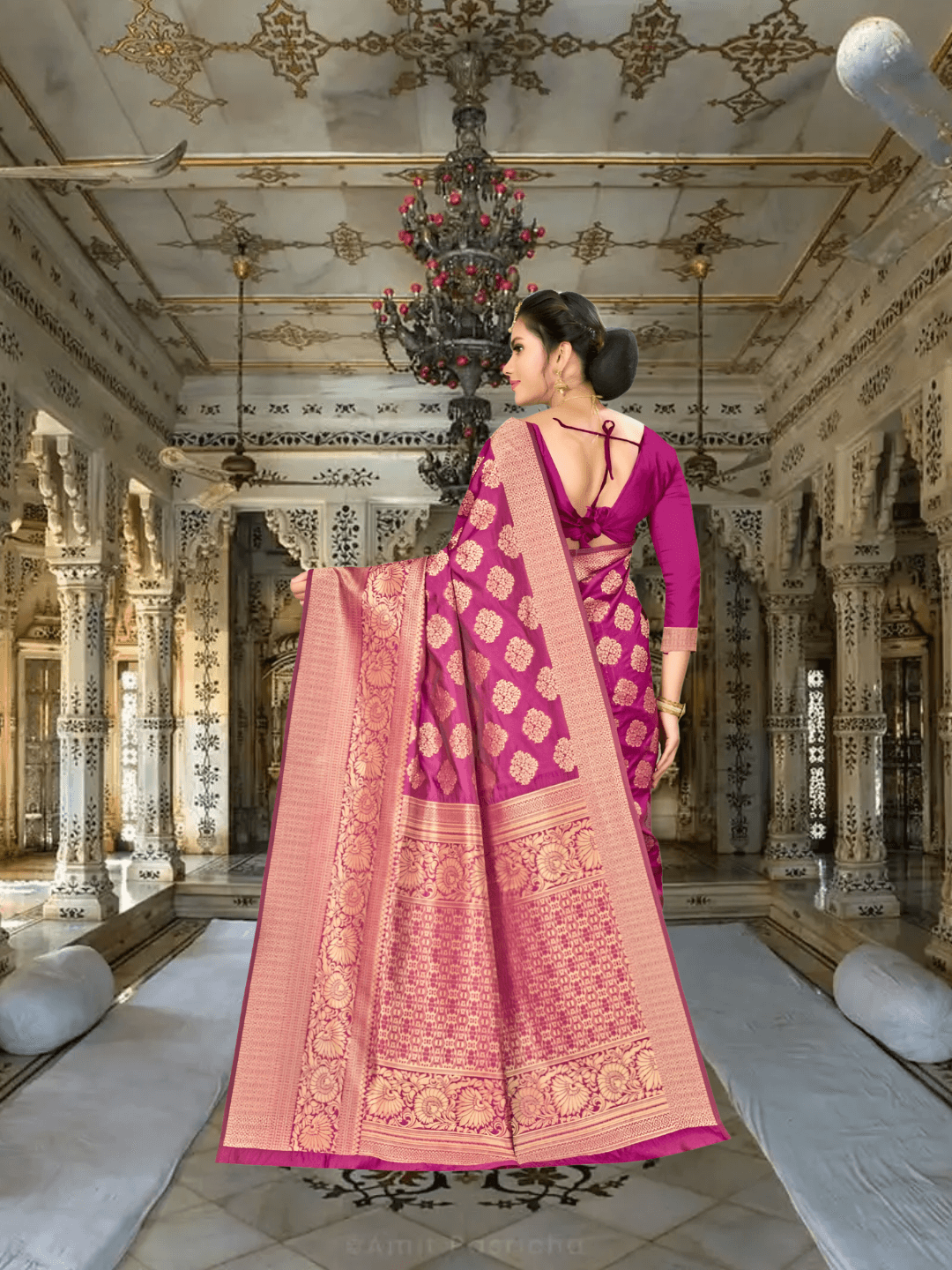 Close-up of golden zari pallu on wine Banarasi silk saree in royal backdrop