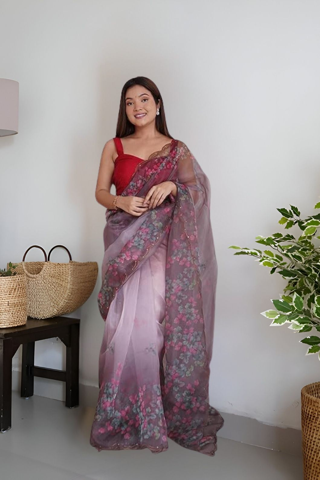 Front angle of wine colored organza saree with floral prints