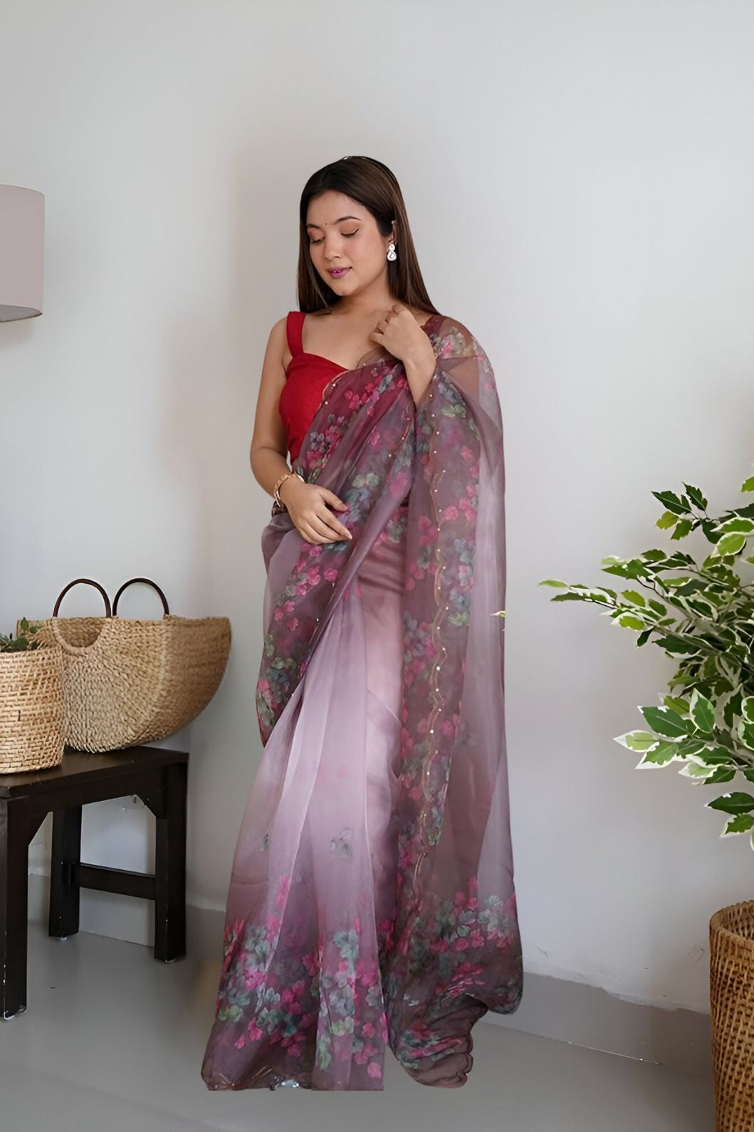 Front angle of wine colored organza saree with floral prints