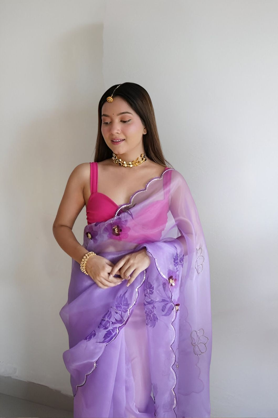 Front view of CELESTINA purple organza saree in royal palace setting
