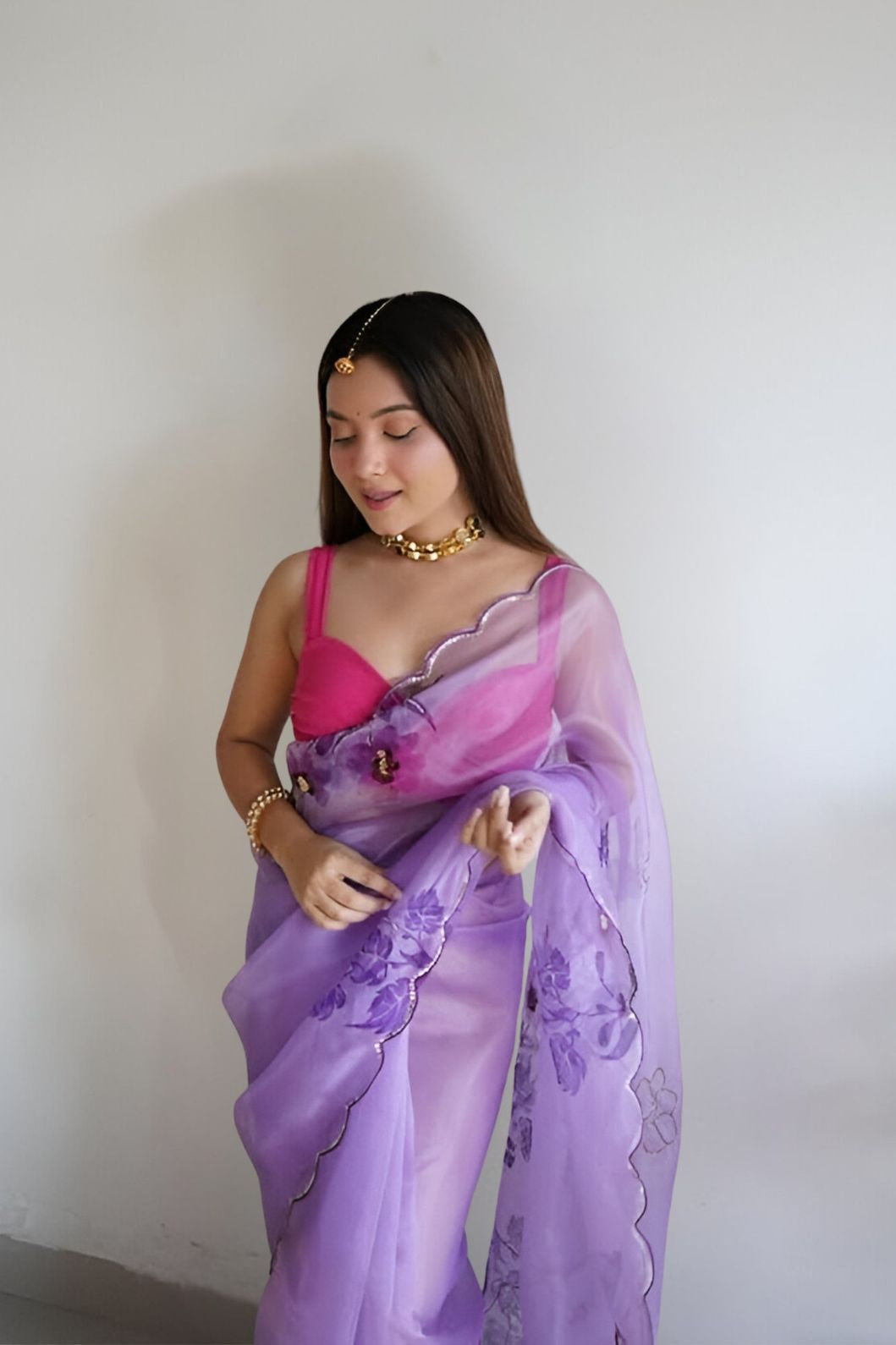 Front view of CELESTINA purple organza saree in royal palace setting