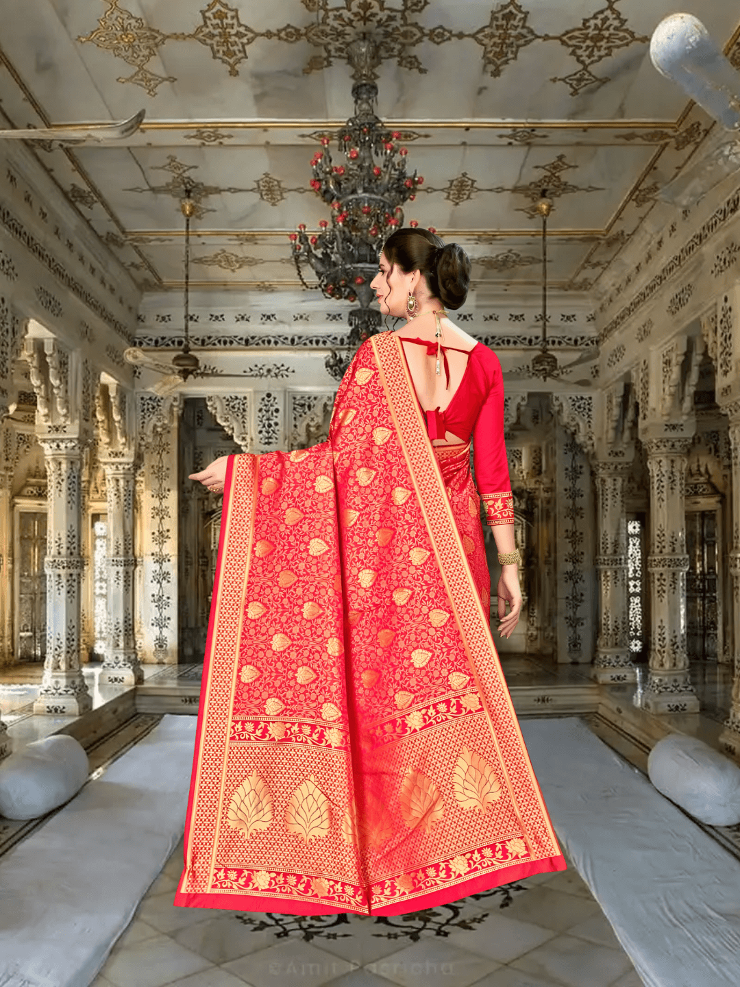 Golden pallu drape of Banarasi saree flowing in regal setting