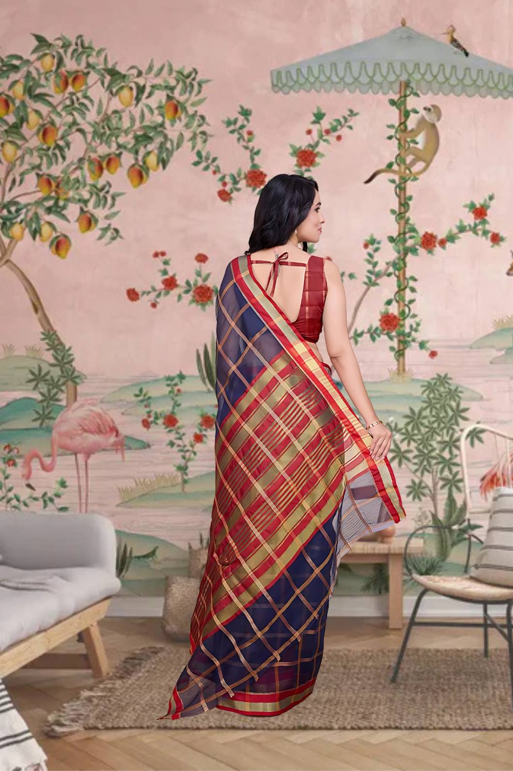 Back angle with soft flowing pallu and checkered detailing