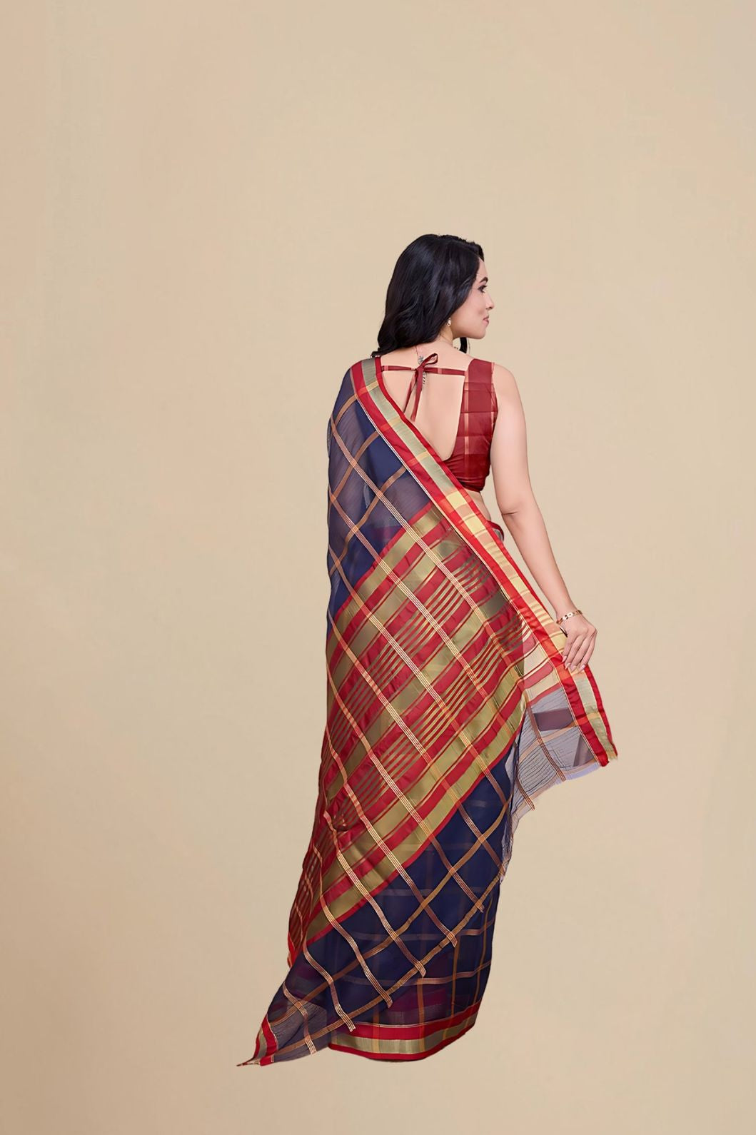 Studio back angle showing unstitched blouse combo and pallu trail