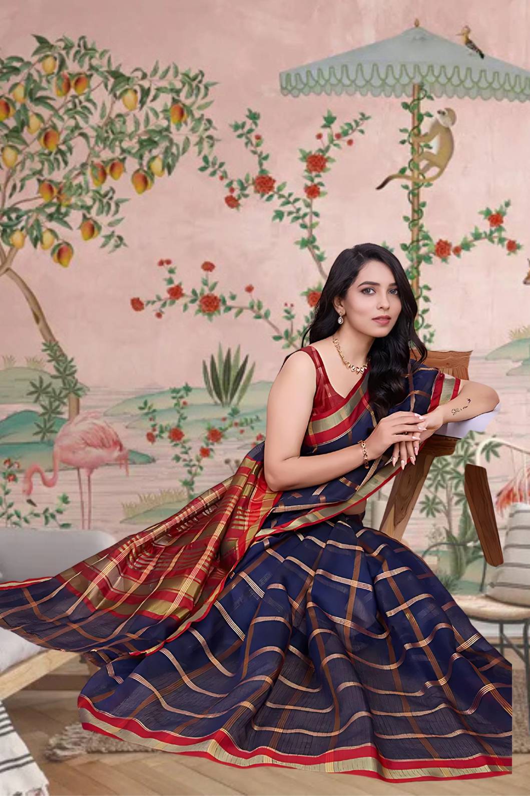 Front view of navy blue checkered saree radiating elegance in palace lighting