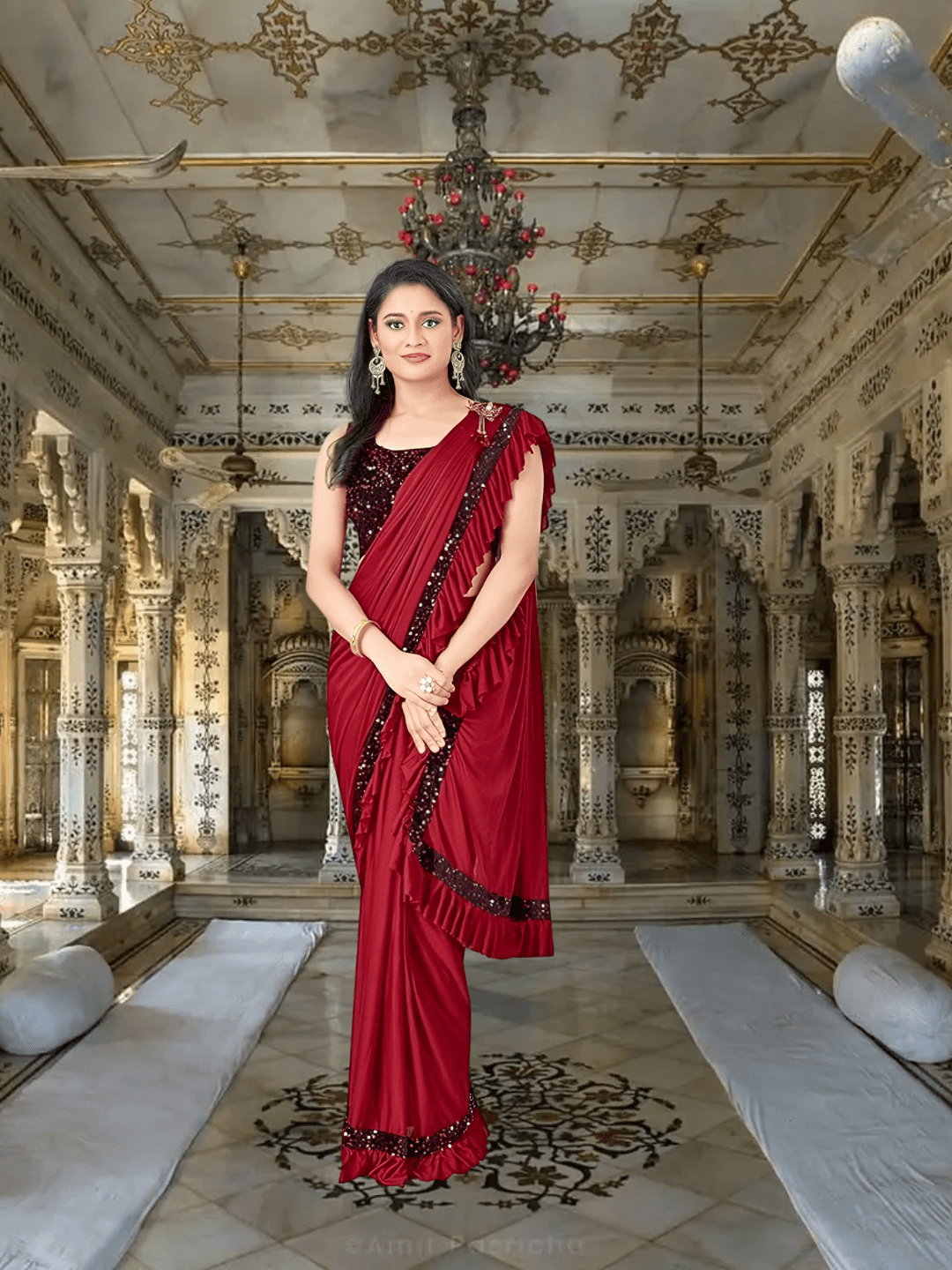 Elegant back drape of red saree with pleated pallu