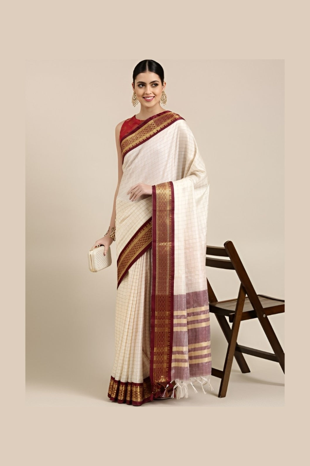 Studio front angle of white checkered saree with defined maroon blouse