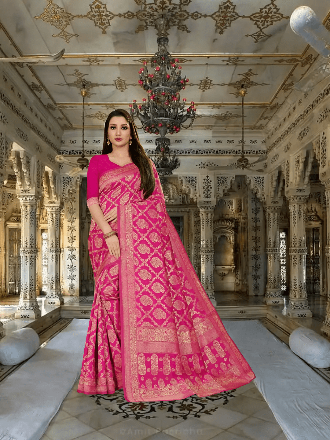 Pink Kanjivaram silk saree glowing in regal ambience, gold threads sparkling in archway light
