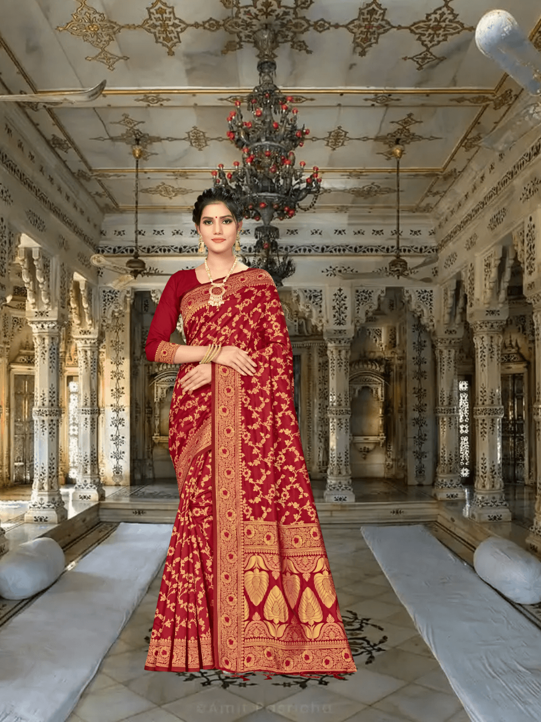 Vibrant maroon saree in sunlight, gold florals reflecting like scattered coins