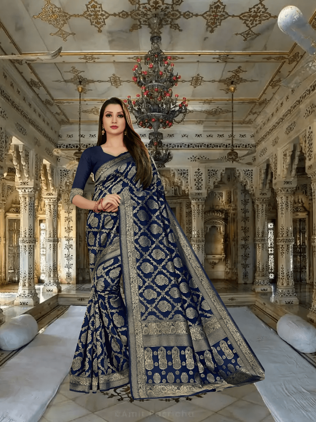 Navy blue silk saree cascading like velvet in a palace corridor, gold thread glowing softly.