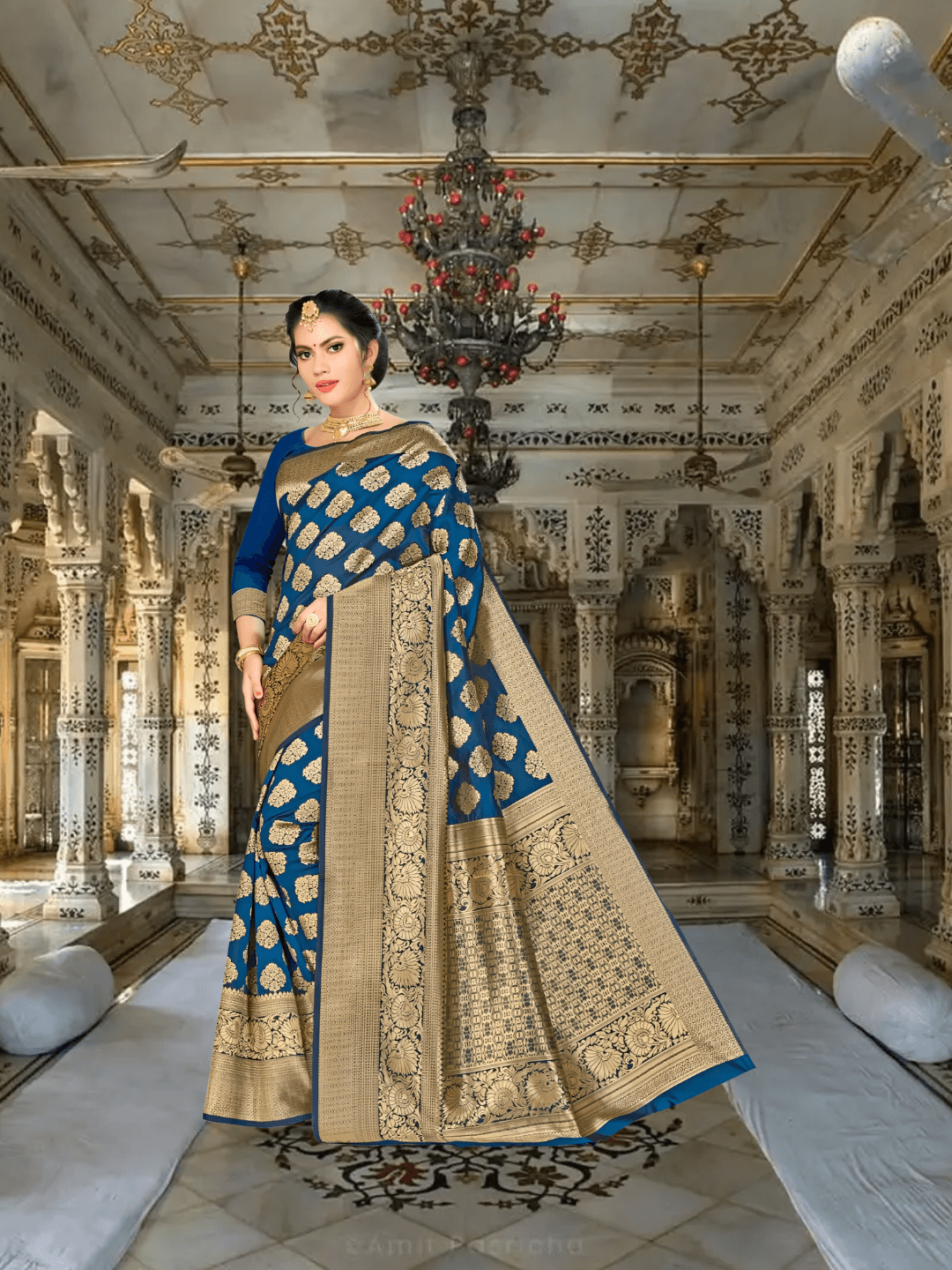 Detailed antique gold border on teal Banarasi silk with musical motif accents