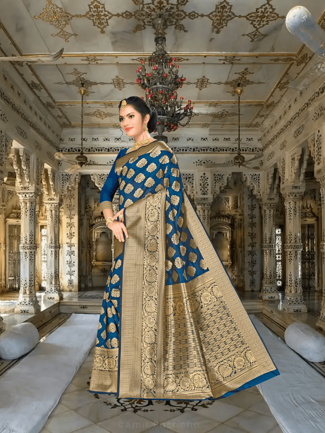Model in teal blue Banarasi silk saree with antique gold zari in palace setting