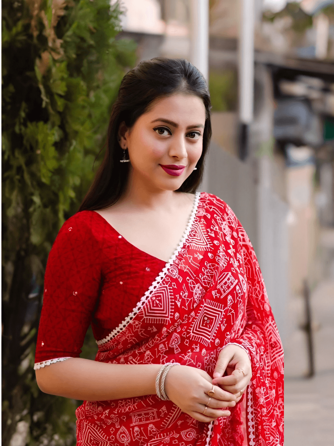 Red abstract georgette saree against modern art backdrop