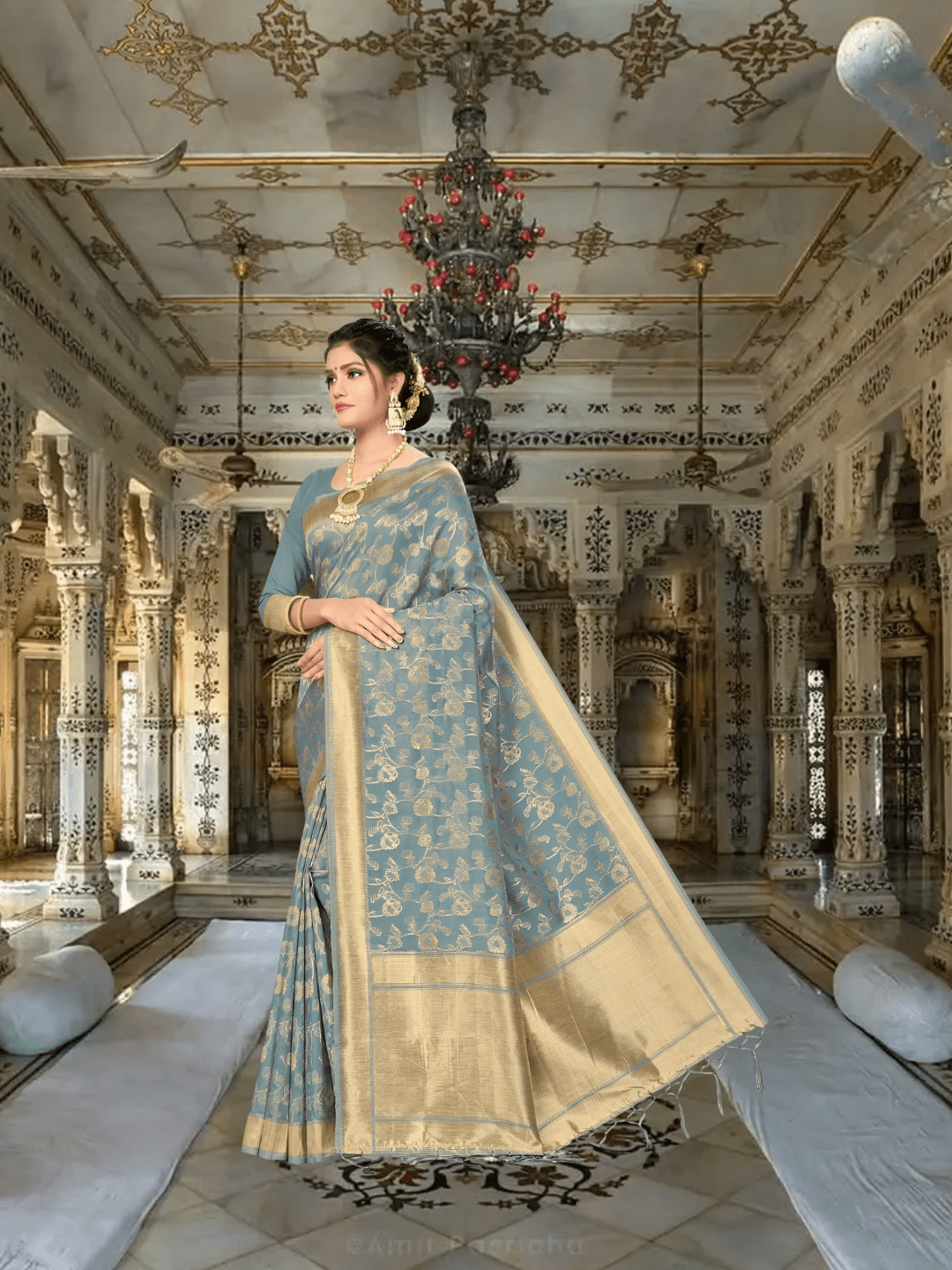 Model draped in grey Banarasi cotton saree with gold borders in palace backdrop