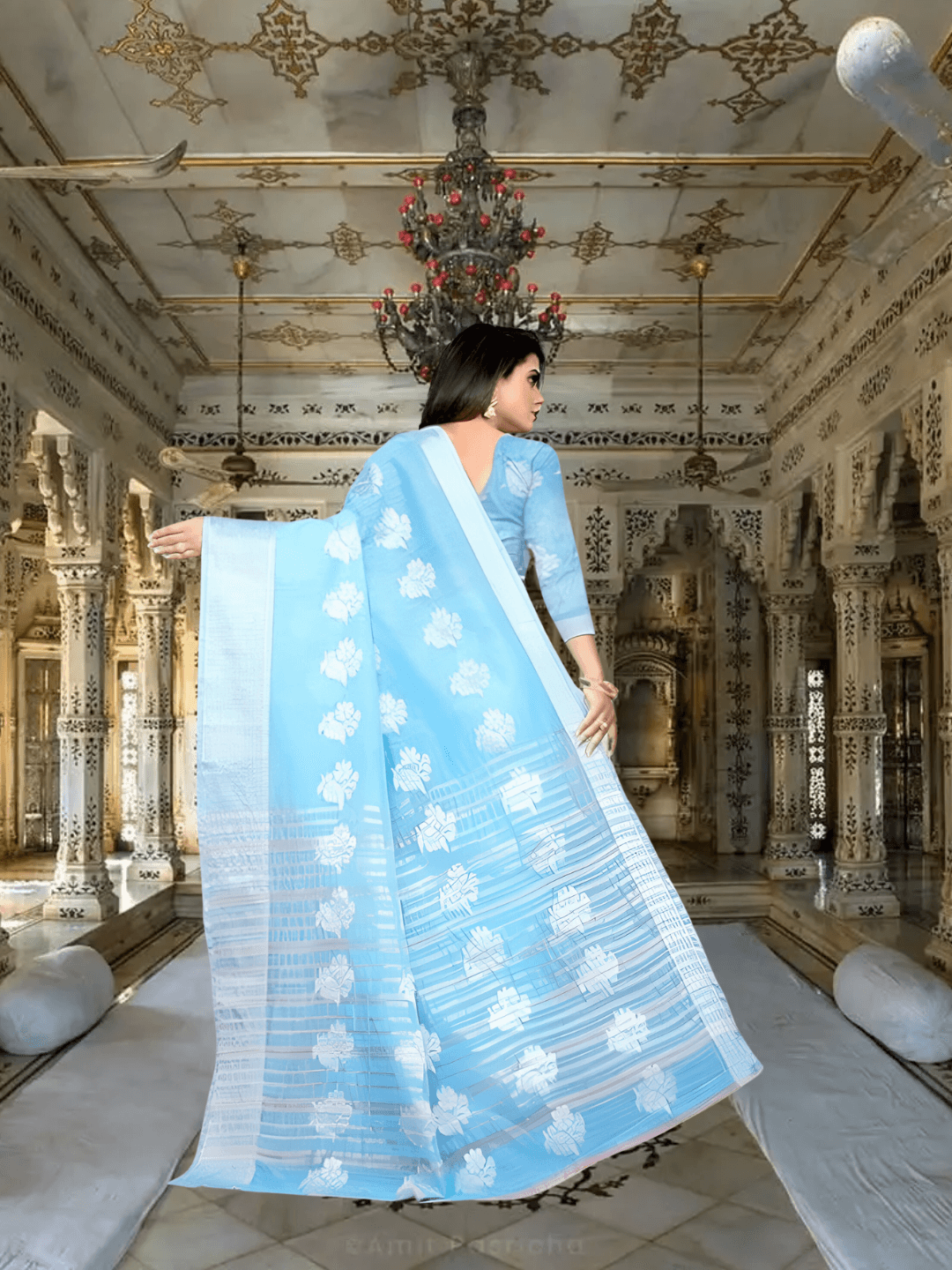 Bride's mother in sky blue saree at beachside wedding ceremony