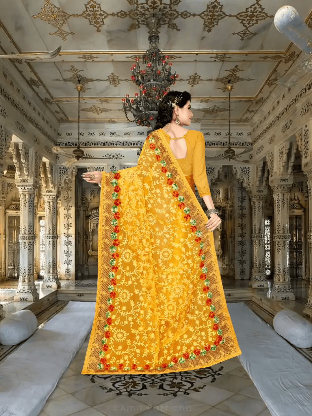 Model mid-step, saree flowing like molten marigold, regal patterns in motion