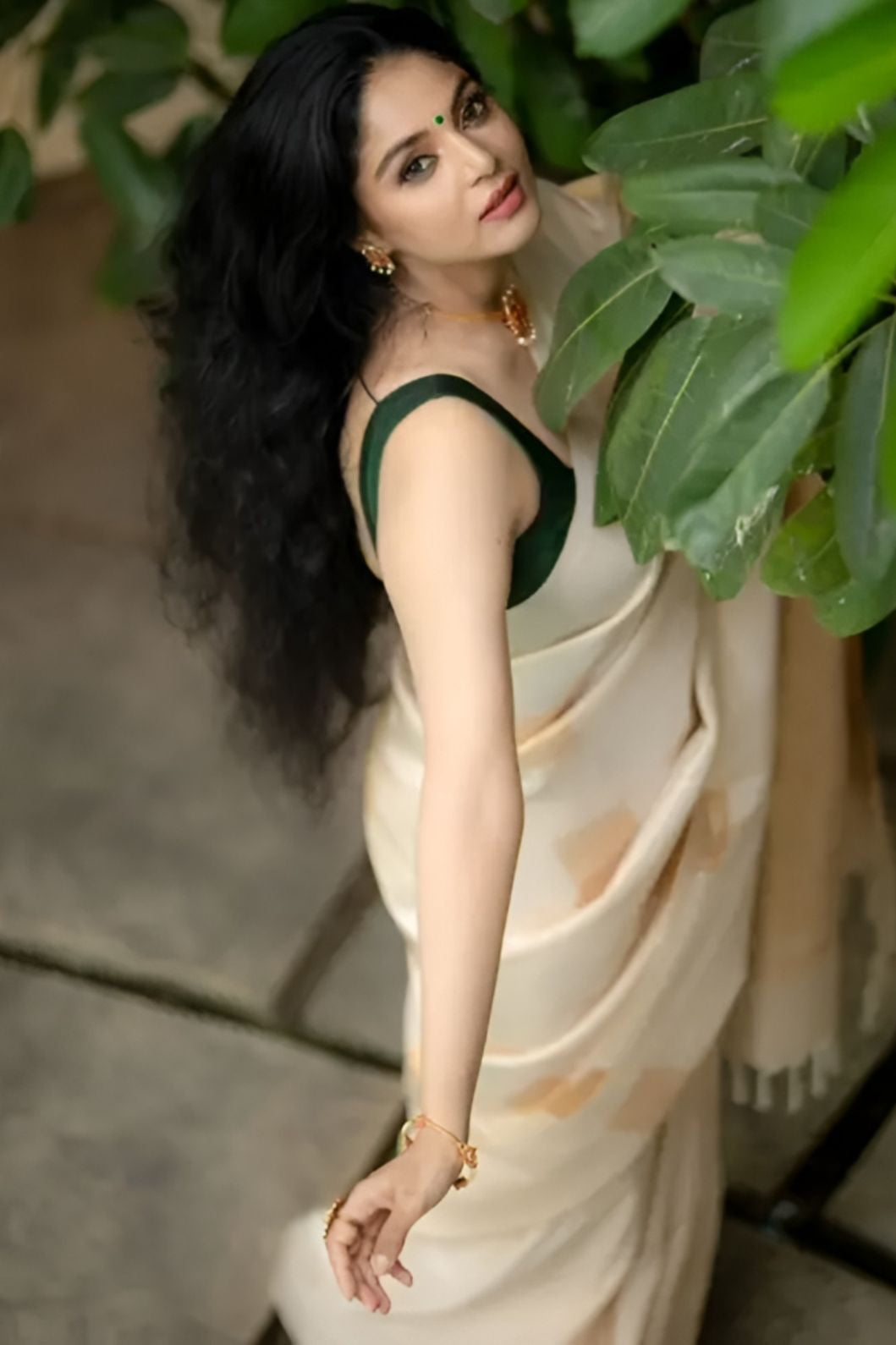 Studio top shot of off-white printed silk saree