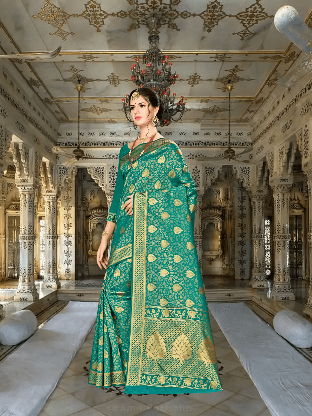 Close-up of gold zari border on green silk saree
