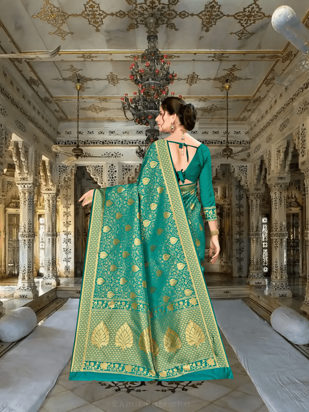Emerald green Banarasi pallu flowing with zari accents in royal setting