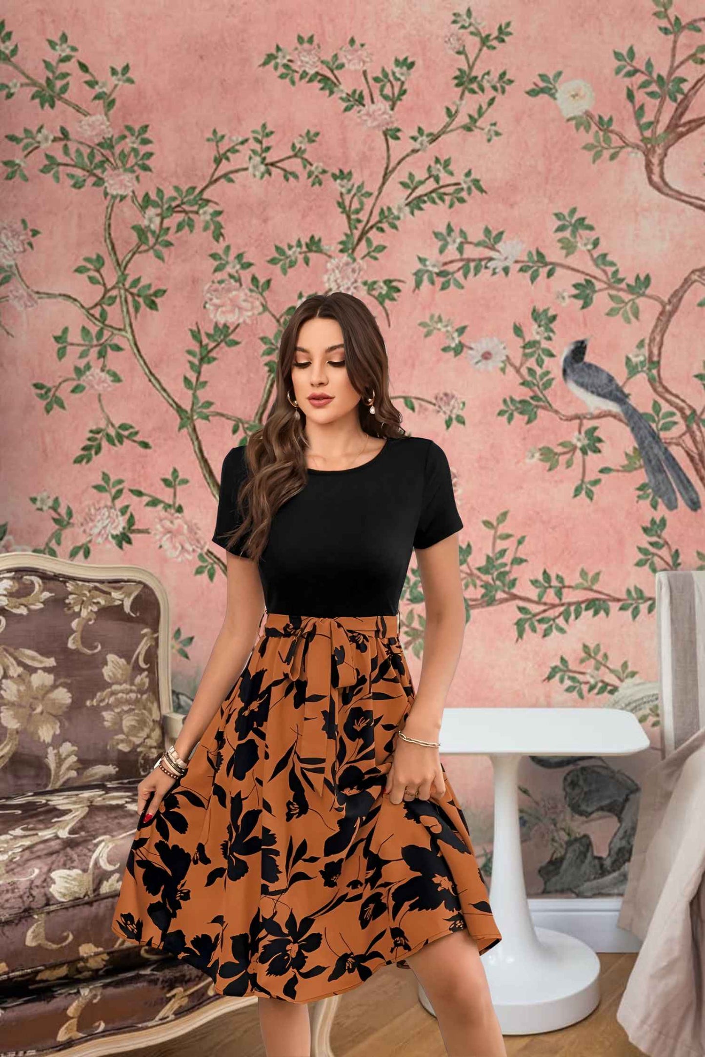 Close-up of floral prints on orange skirt