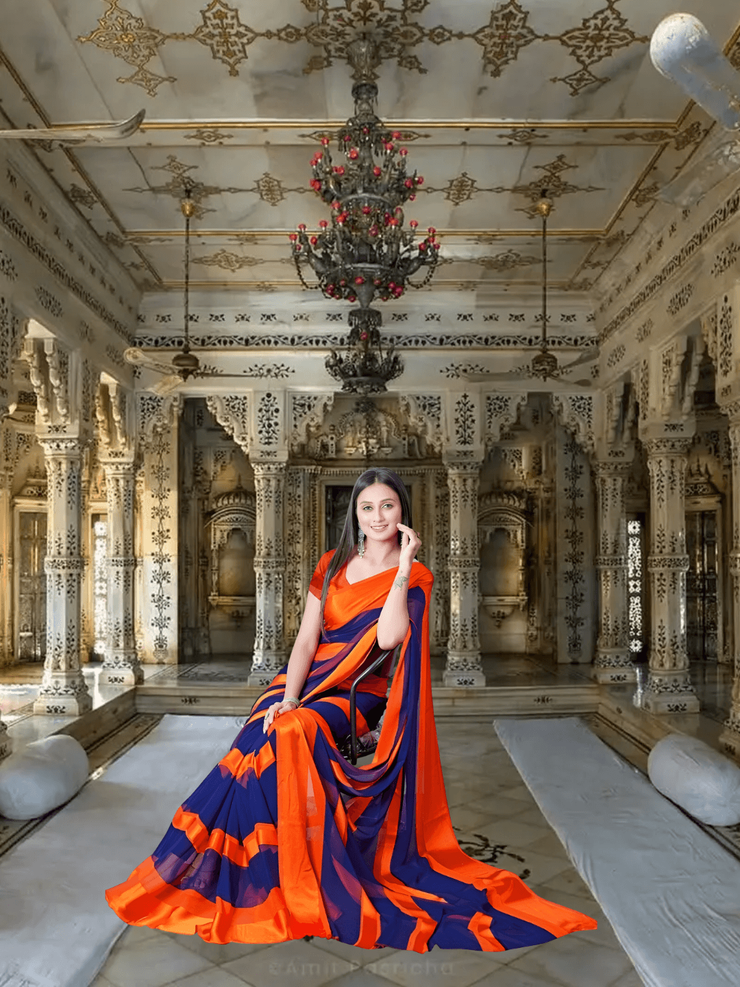 Model seated in orange-navy saree for minimalist wedding