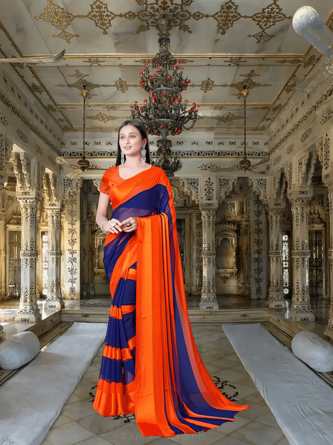 Woman twirling orange-to-navy solid saree in desert sunset