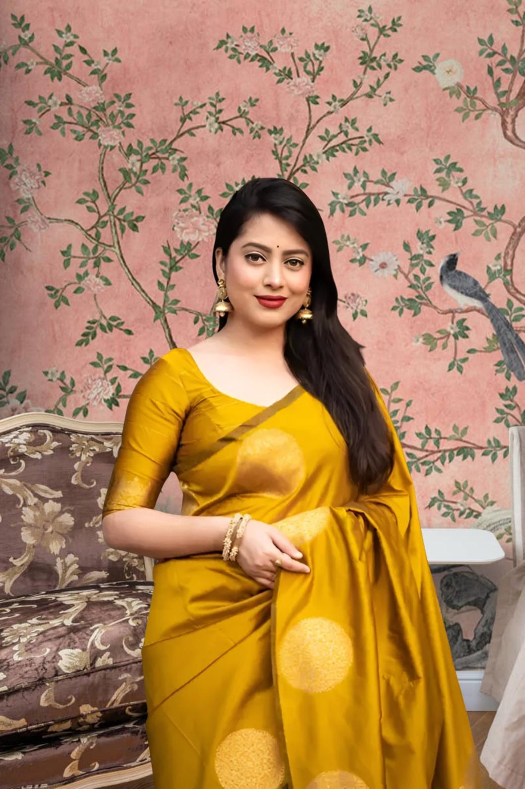 Front view of yellow silk printed saree glowing in regal setting