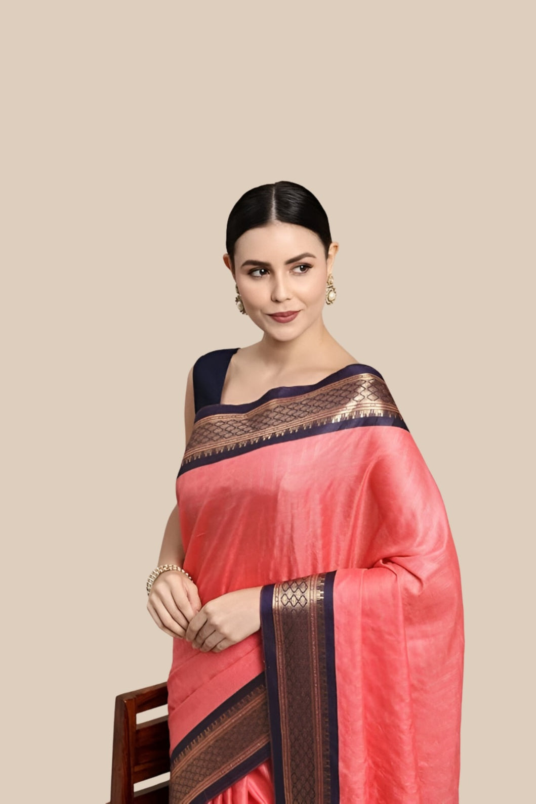 Studio front shot of pink saree with checkered body and border