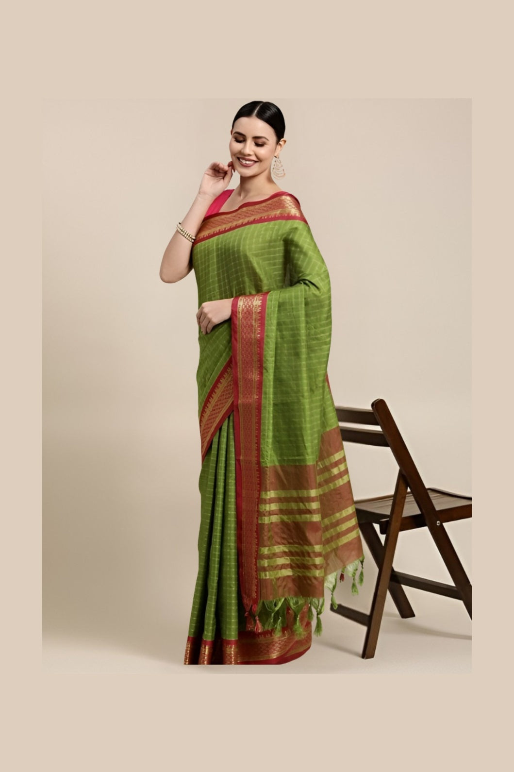 Studio front shot of white checkered saree with deep Mehendi blouse