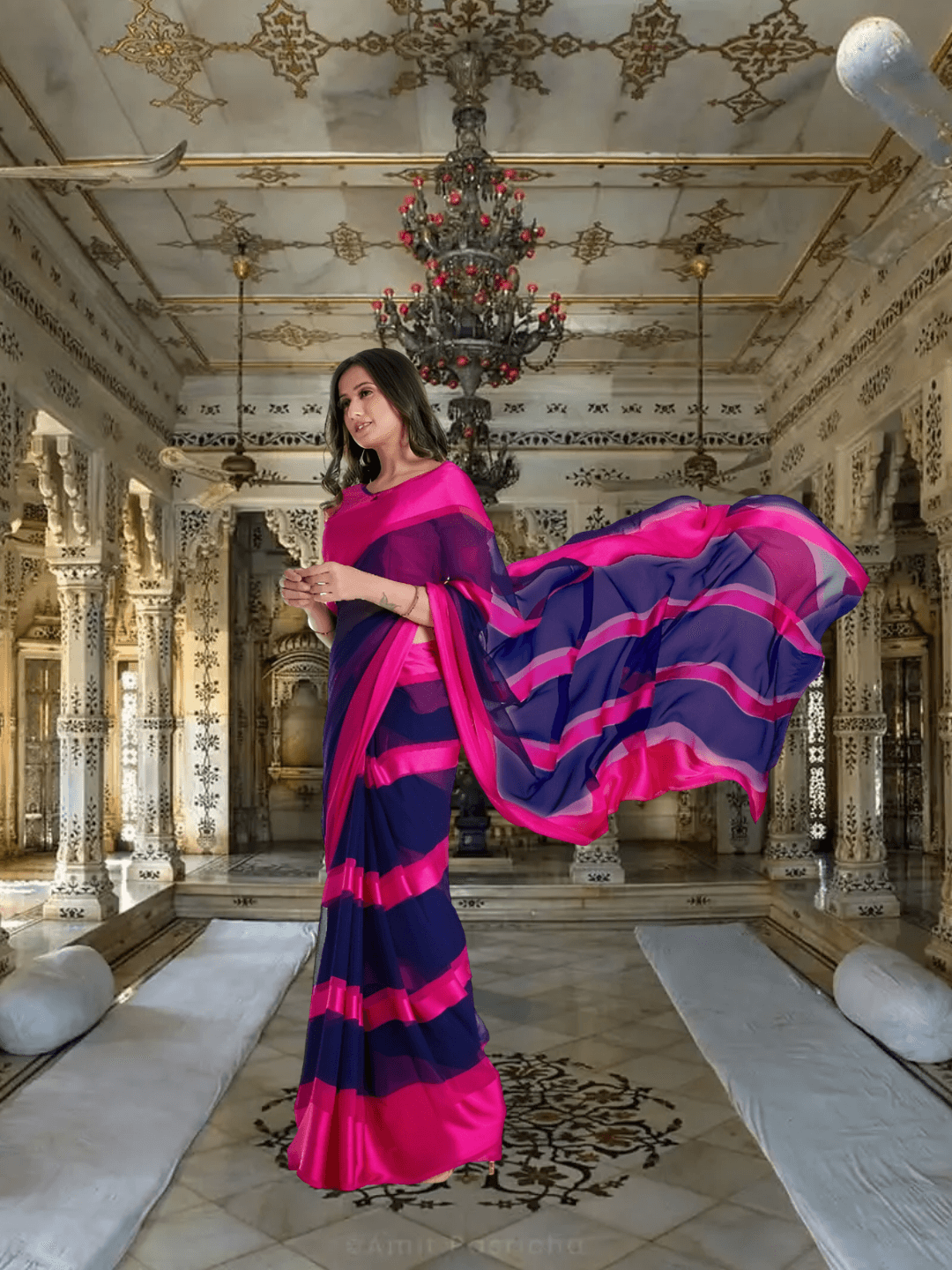 Bride walking in pink-navy saree with gradient pallu flowing