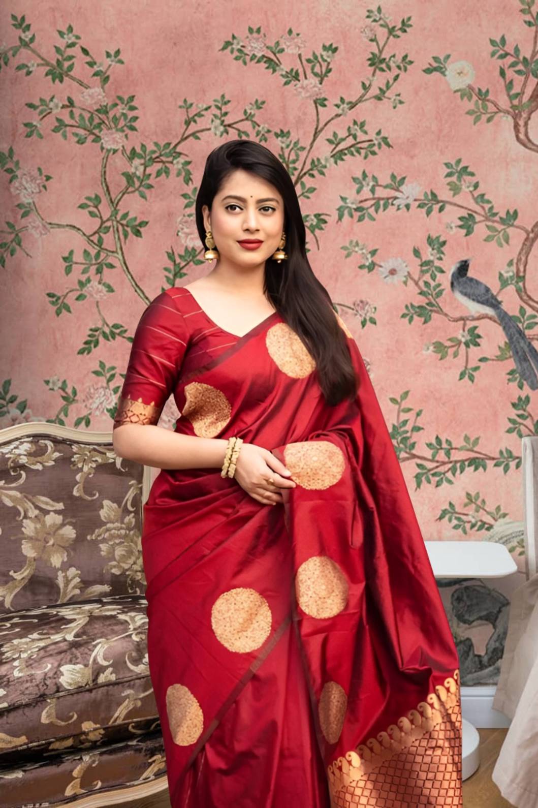 Front view of red silk saree blazing in royal setting