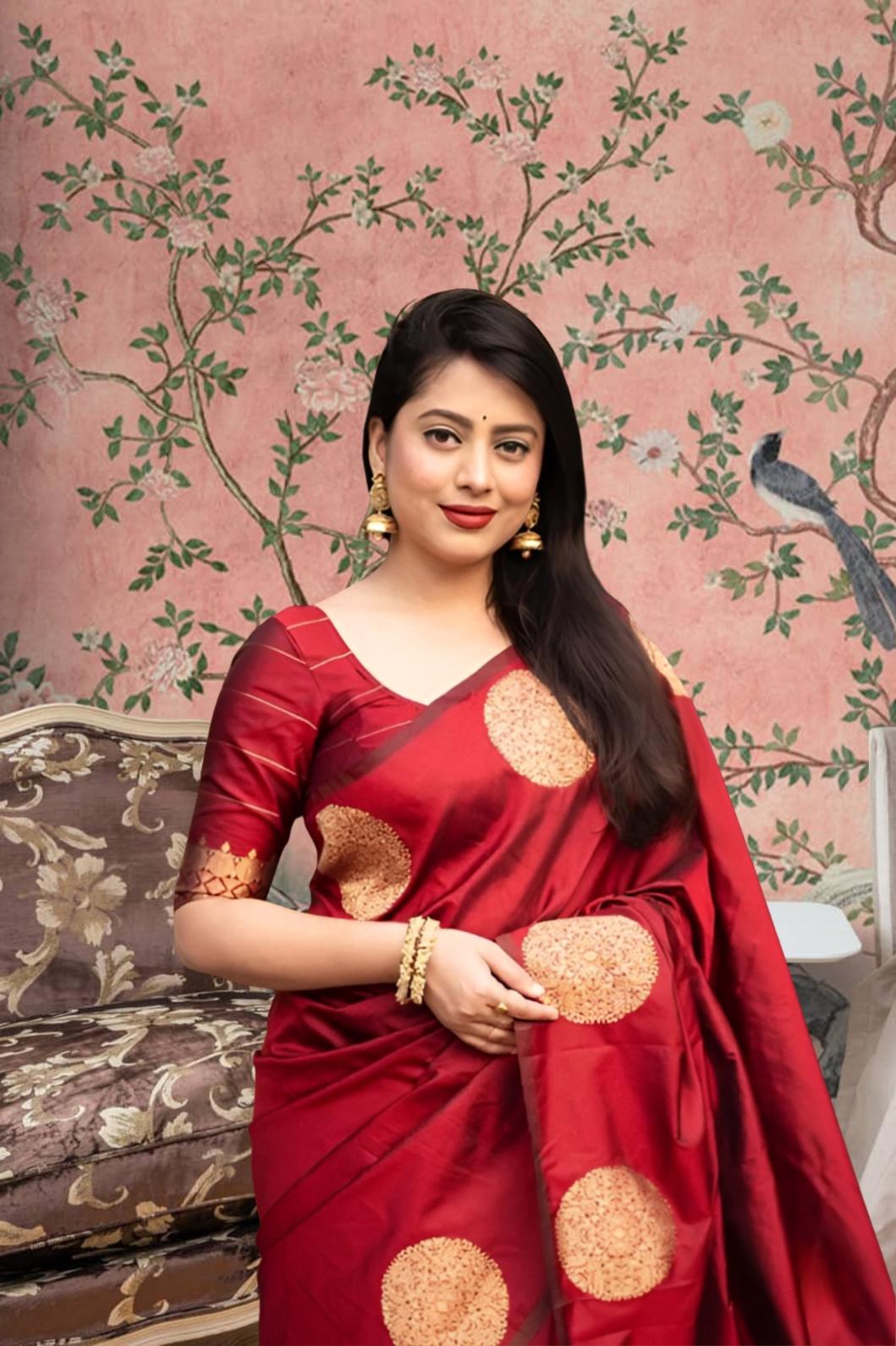 Front view of red silk saree blazing in royal setting